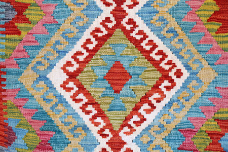 Albanian handicraft pattern in a souvenir shop in Kruje, Albania. Artisanal textile with traditional...
