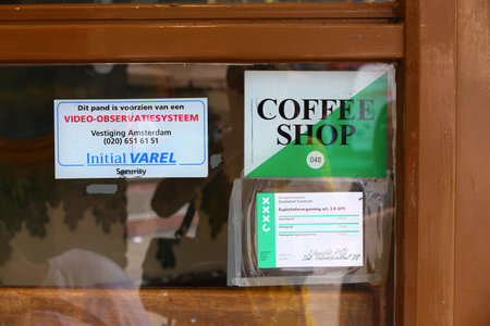 AMSTERDAM, NETHERLANDS - JULY 8, 2017: Legal permit in a window of a coffee shop in Amsterdam,...