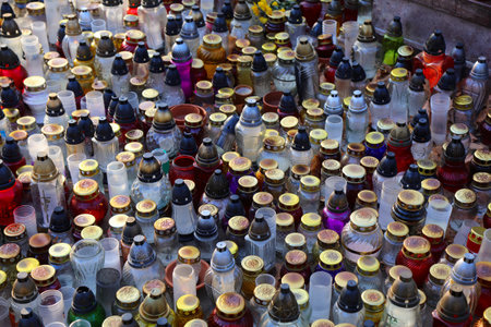 Cemetery in Poland. Daytime view of znicz grave candles on All Saints Day (Wszystkich Swietych in...