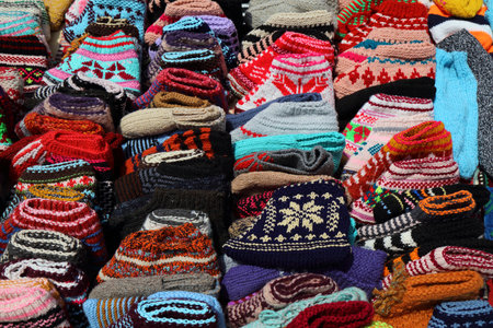 Albanian handicraft products in a souvenir shop at Pazari i Ri (New Bazaar) in Tirana city, Albania. Wool knitwear colorful hats.の写真素材