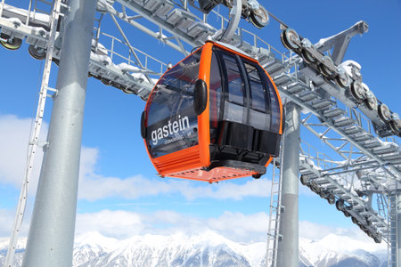 BAD GASTEIN, AUSTRIA - MARCH 9, 2016: People ride gondolas of cable car in Bad Gastein. It is part of Ski Amade, one of largest ski regions in Europe with 760km of ski runs.のeditorial素材