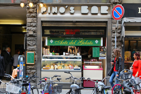 FLORENCE, ITALY - MAY 1, 2015: People walk by traditional artisanal gelato ice cream bar in Florence, Italy.のeditorial素材
