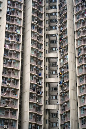 Hong Kong high density public housing residential estate. Urban overpopulation. Hoi Fu Court in Tai Kok Tsui, Yau Tsim Mong District of Kowloon, Hong Kong.の写真素材