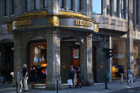 DUSSELDORF, GERMANY - SEPTEMBER 19, 2020: People walk by Hermes luxury fashion brand store in...