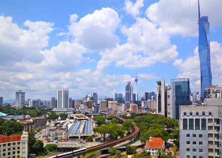 Kuala Lumpur city skyline with public transportation train line in foreground. Kuala Lumpur, Malaysia.の写真素材