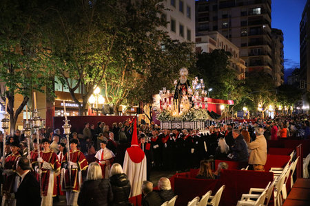 ALICANTE, SPAIN - APRIL 16, 2025: Semana Santa (Holy Week) procession, local religious celebration...