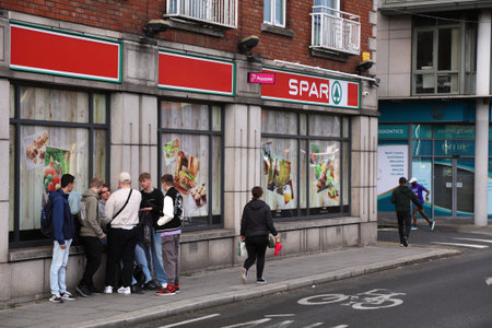 DUBLIN, IRELAND - JULY 5, 2024: People visit Spar brand grocery store in downtown Dublin, Ireland.