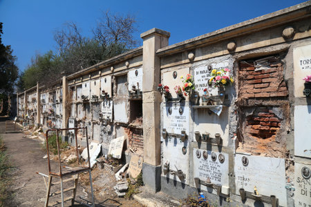 CATANIA, ITALY - AUGUST 14, 2024: Collapsing neglected columbariums at Cimitero Monumentale...