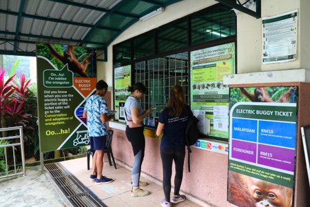 KUCHING, MALAYSIA - MARCH 10, 2024: People buy tickets for Semenggoh Wildlife Centre orangutan...