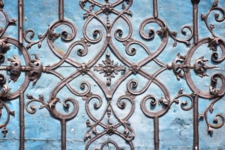 Architecture detail in Wroclaw, Poland - vintage cast iron gate ornaments.
