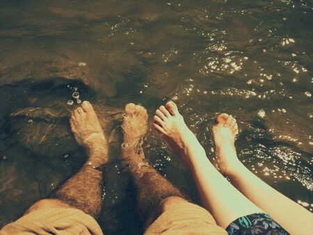 Happy feet enjoying the riverの写真素材
