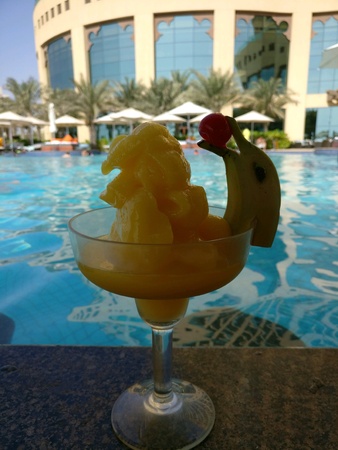 Frozen mango margarita on a pool barの素材