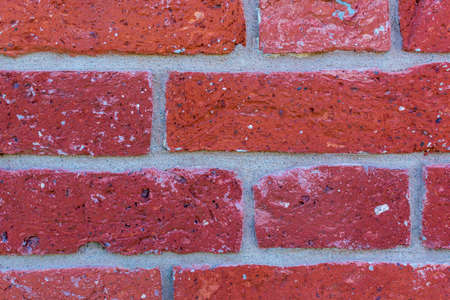 Old red brick wall texture close up with copy space. Background image of rough stone wall of...