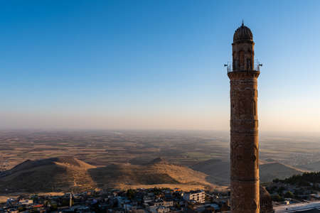 Minaret of Ulu Mosque in the old center of Mardin against Mesopotamian landscapeのeditorial素材