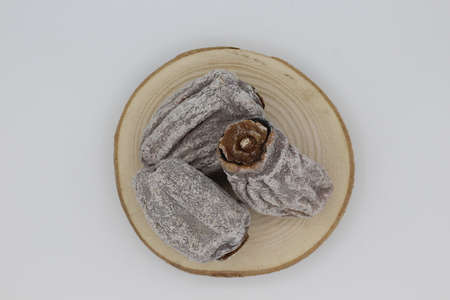 Dried persimmon fruit sold by the herbalist. Known name in English: Persimmon