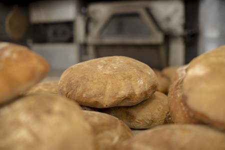 Bread in front of the ovenの写真素材