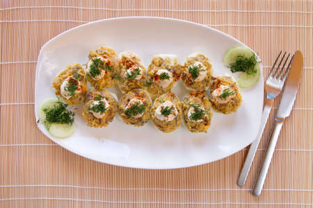 Russian egg on white plateの写真素材