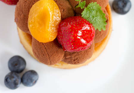 fruit tart with strawberries, blueberries and apricots の写真素材