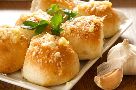 Ukranian Bread with sezame and garlic on wooden table の写真素材