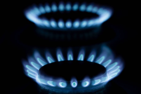 Close up of a gas burner on black background