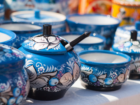 Russian wooden utensils. Painted in khokhloma style. Traditional Russian souvenir. Kitchen Decor.の写真素材