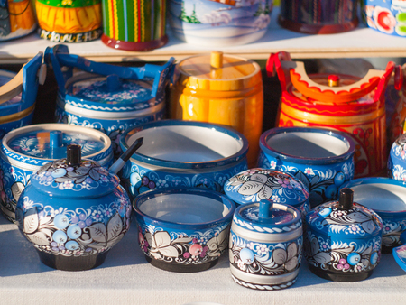 Russian national wooden utensils at the fair. Traditional Russian souvenir. Kitchen Decor.の写真素材