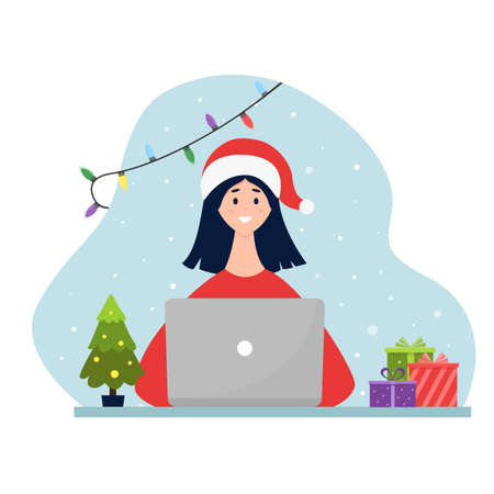 Woman in santa hat working on laptop. Christmas workplace. Flat vector illustration.のイラスト素材
