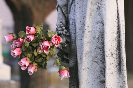 Statue and flower bouquetの写真素材