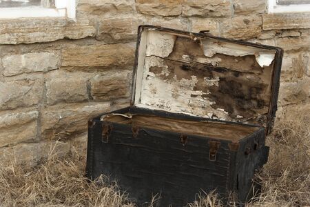 Abandoned antique trunkの写真素材