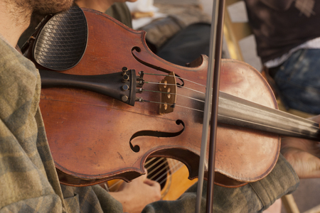 Violinist performing at a farmers marketの写真素材