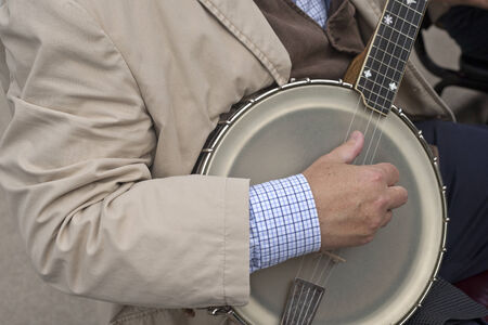 Banjo player entertaining at the outdoor marketの写真素材