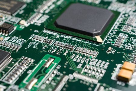 Detail of an electronic printed circuit board with many electrical components