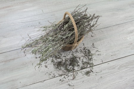 Dried lavender in a basket on the gray tableの写真素材