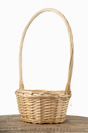Empty wicker basket on a white backgroundの写真素材