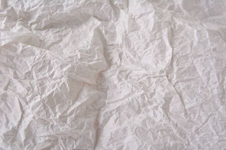 textured clean sheet of crumpled paper white color for pure and empty backgroundsの写真素材