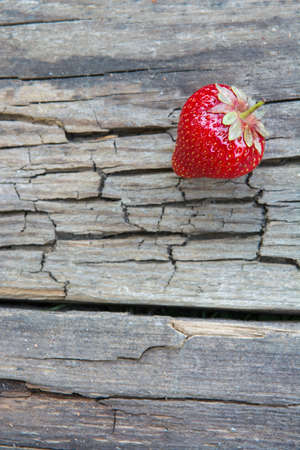 Strawberries on the surface old wooden tableの写真素材