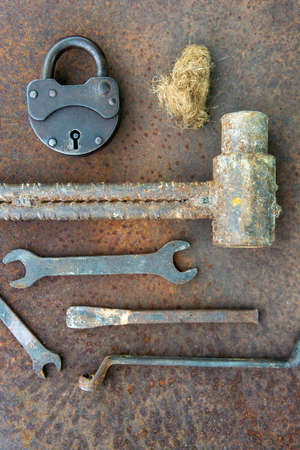 Ancient rusty tools on a metal surface. Steampunk style.の写真素材