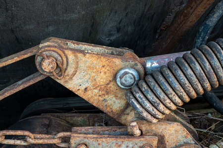 Rusty old spring. Part of agricultural machinery. Steampunk styleの写真素材