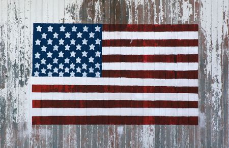 handpainted flag on the side of a barnの写真素材