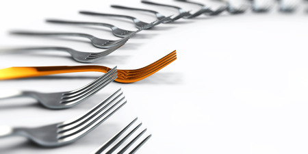 A gold fork on a white backgroundの写真素材