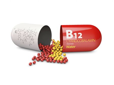 3d rendering of vitamin B12 pills over white background. Concept of dietary supplements.の写真素材