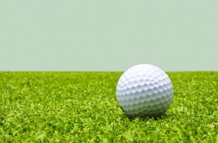 Golf ball on a green meadowの写真素材