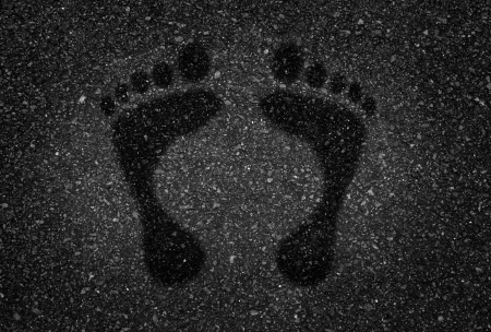 Bare footprints on the road  の写真素材