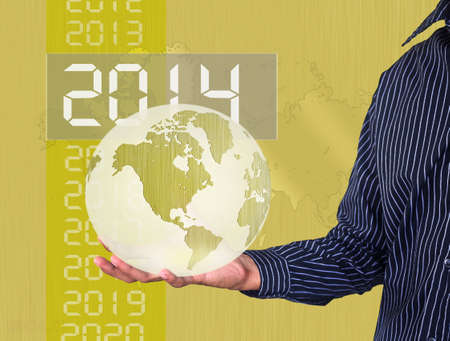 gold ball earth in hand businessman の写真素材