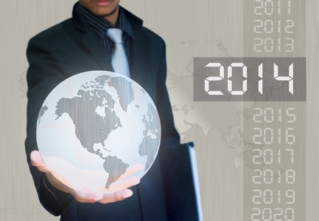 silver ball earth in hand businessman 2014  yearの写真素材