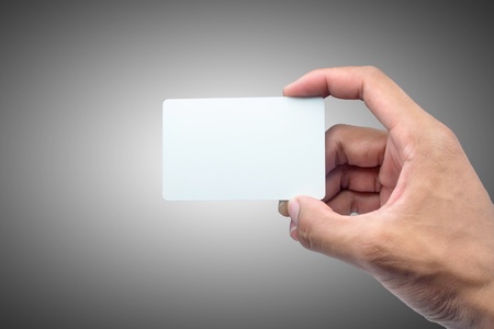 Hand holding card with empty space の写真素材