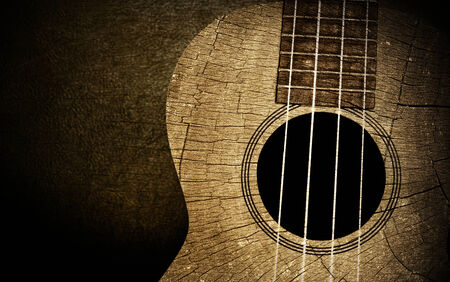 Ukulele in wood texture backgroundの写真素材
