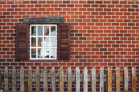 White window on an old brick wall backgroundの写真素材