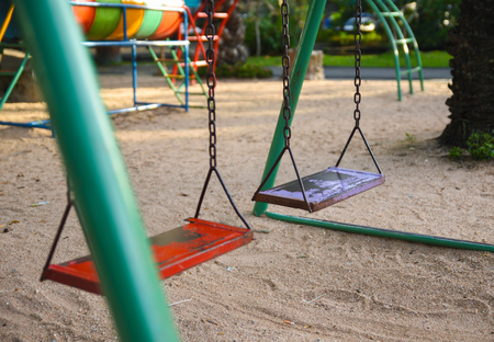 Empty swing on children playgroundの写真素材