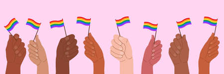 People at the pride parade hold flags and posters with the LGBT symbol. The right to self-affirmation and equality. Celebrating Pride Month against discrimination and violence.